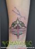Pink dragonfly wrist tattoo